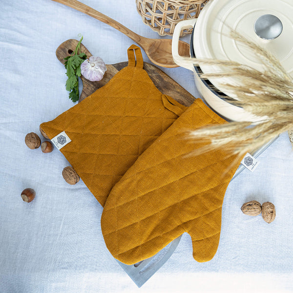 Crafted with care, these amber yellow linen oven mitten sets are the perfect companions for your culinary adventures.