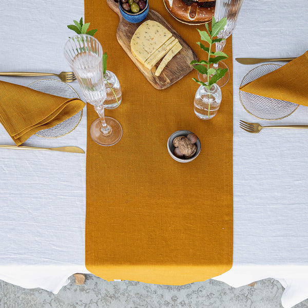 Give your table a touch of distinction and decoration with our amber yellow linen table runner. Use the table runner on its own or combine it with a linen tablecloth, placemats or napkins.