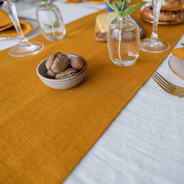 Give your table a touch of distinction and decoration with our amber yellow linen table runner. Use the table runner on its own or combine it with a linen tablecloth, placemats or napkins.