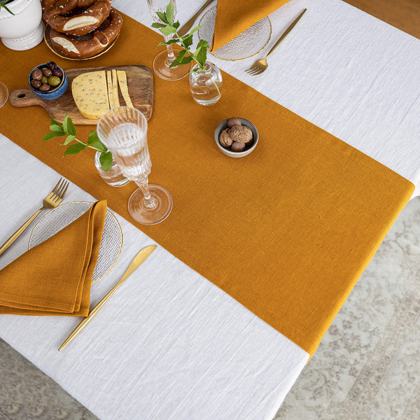 Give your table a touch of distinction and decoration with our amber yellow linen table runner. Use the table runner on its own or combine it with a linen tablecloth, placemats or napkins.