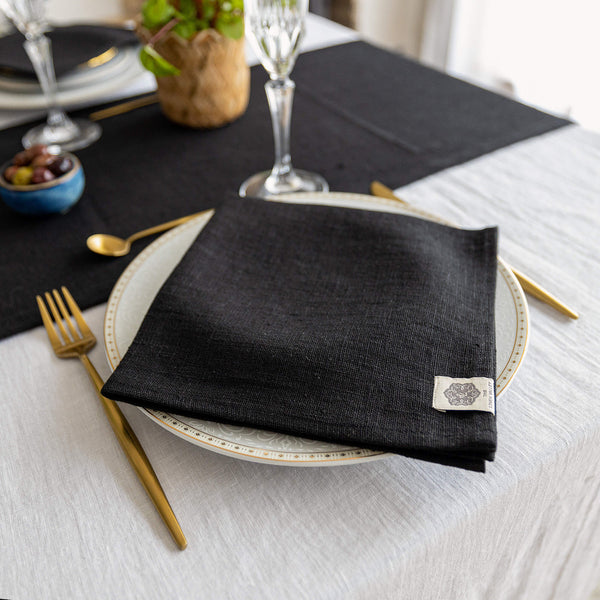 Introducing our black linen napkins set, designed to elevate your dining experience with a touch of warmth and charm. Crafted with care, these napkins are the perfect companions for your culinary adventures.