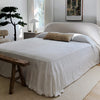 Bright white linen bedspread designed to infuse your bed with an extra touch of uniqueness, coziness and charm. Draped elegantly over your bed as a bedspread or wrapped snugly around you on chilly nights, it's versatile enough to suit your needs.