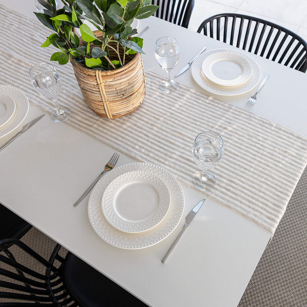 Crafted with care, this runner adds a touch of distinction and sophistication to any dining experience. The subtle yet refined design lends versatility, making it suitable for both casual gatherings and formal occasions.