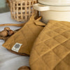 Crafted with care, these dusty mustard linen oven mitten sets are the perfect companions for your culinary adventures.