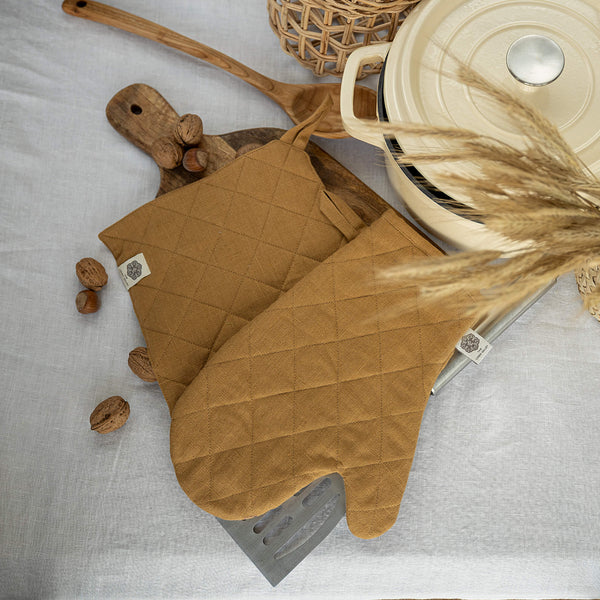 Crafted with care, these dusty mustard linen oven mitten sets are the perfect companions for your culinary adventures.