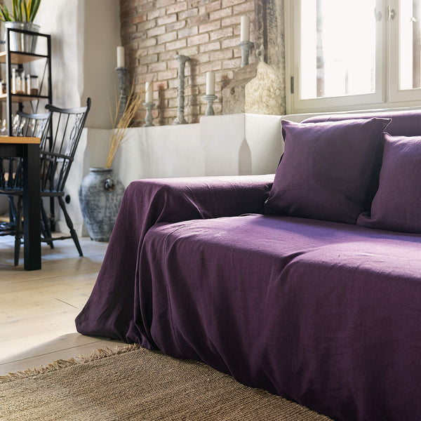 Choosing deep purple colour for your couch cover not only offers protection but also brings a timeless elegance to your home interior.