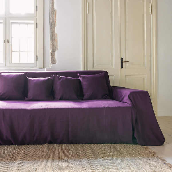 Choosing deep purple colour for your couch cover not only offers protection but also brings a timeless elegance to your home interior.