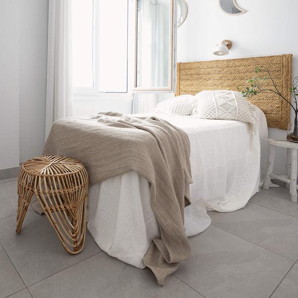 Rustic heavy linen waffle throw crafted from a cozy waffle weave, blanket adds a layer of warmth and style to any bedroom decor.