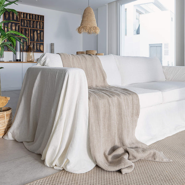 Rustic heavy linen waffle throw crafted from a cozy waffle weave, blanket adds a layer of warmth and style to any bedroom decor.