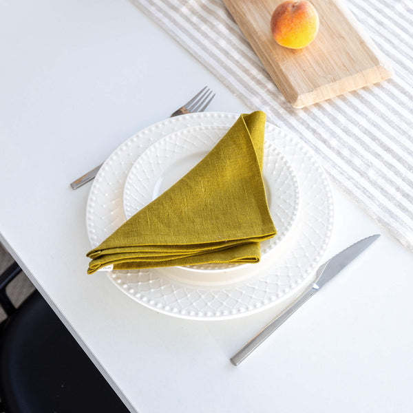 Introducing our olive green linen napkins set, designed to elevate your dining experience with a touch of warmth and charm. Crafted with care, these napkins are the perfect companions for your culinary adventures.