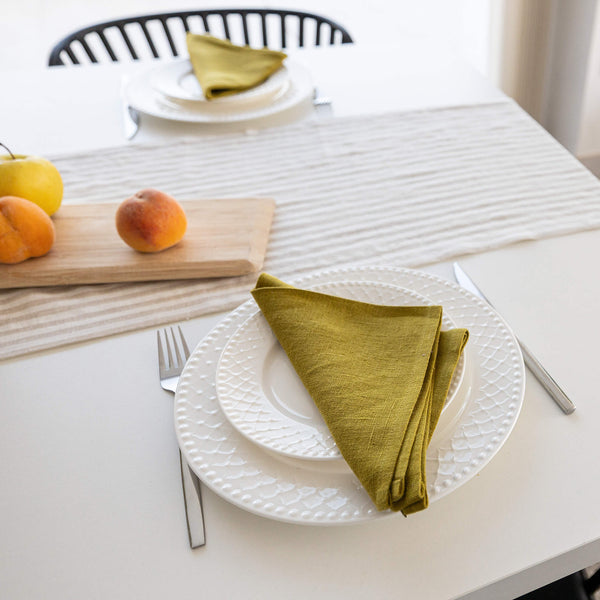 Introducing our olive green linen napkins set, designed to elevate your dining experience with a touch of warmth and charm. Crafted with care, these napkins are the perfect companions for your culinary adventures.