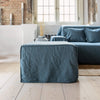 Ocean blue linen couch cover designed and crafted to elevate your interior with a fresh look and great energy. It offers a practical solution for safeguarding your furniture against the playful antics of your beloved pets.