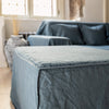 Ocean blue linen couch cover designed and crafted to elevate your interior with a fresh look and great energy. It offers a practical solution for safeguarding your furniture against the playful antics of your beloved pets.