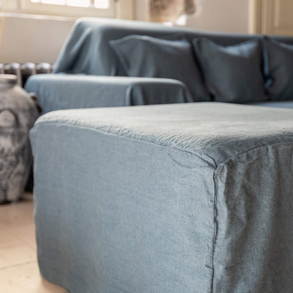 Ocean blue linen couch cover designed and crafted to elevate your interior with a fresh look and great energy. It offers a practical solution for safeguarding your furniture against the playful antics of your beloved pets.