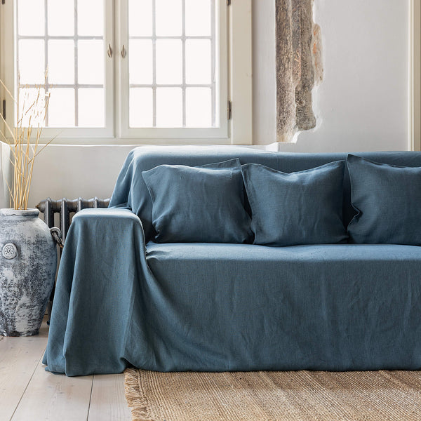 Ocean blue linen couch cover designed and crafted to elevate your interior with a fresh look and great energy. It offers a practical solution for safeguarding your furniture against the playful antics of your beloved pets.