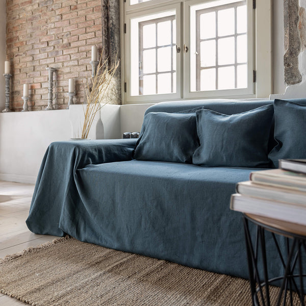 Ocean blue linen couch cover designed and crafted to elevate your interior with a fresh look and great energy. It offers a practical solution for safeguarding your furniture against the playful antics of your beloved pets.