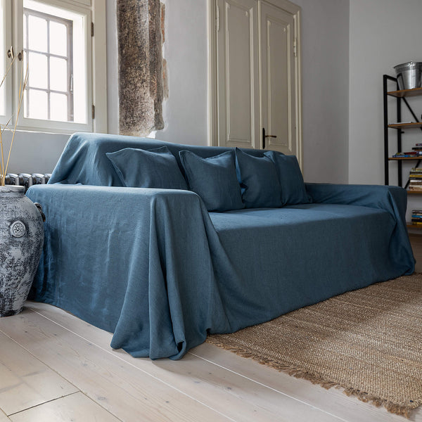 Ocean blue linen couch cover designed and crafted to elevate your interior with a fresh look and great energy. It offers a practical solution for safeguarding your furniture against the playful antics of your beloved pets.