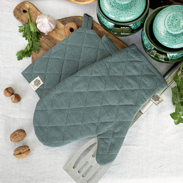 Crafted with care, these teal blue linen oven mitten sets are the perfect companions for your culinary adventures.