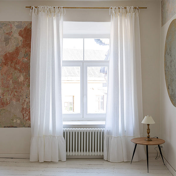 Our optical white linen curtains with ruffles are designed and made to give your home unique and timeless charm. Linen curtains would complement interiors from minimalistic, Scandinavian or modern to Mediterranean or classical style.