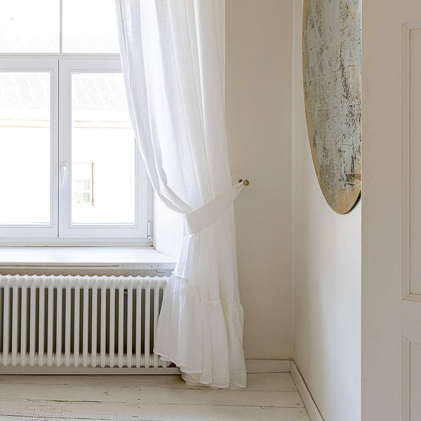 Our optical white linen curtain tie-back the perfect solution to keeping your curtains looking neat and stylish.