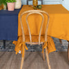 Our amber yellow linen ruffled chair slipcovers offer both practicality and aesthetic appeal. The covers will protect dining chairs from spills and stains, also enhance the visual appeal of your space with their timeless natural style. Slipcovers will simply change your chairs appearance and provide an elegant solution.