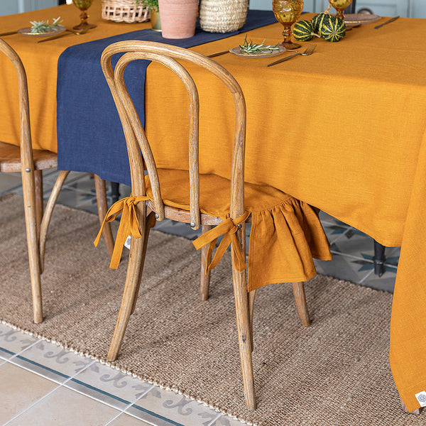 Our amber yellow linen ruffled chair slipcovers offer both practicality and aesthetic appeal. The covers will protect dining chairs from spills and stains, also enhance the visual appeal of your space with their timeless natural style. Slipcovers will simply change your chairs appearance and provide an elegant solution.