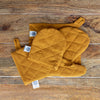 Crafted with care, these amber yellow linen oven mitten sets are the perfect companions for your culinary adventures.