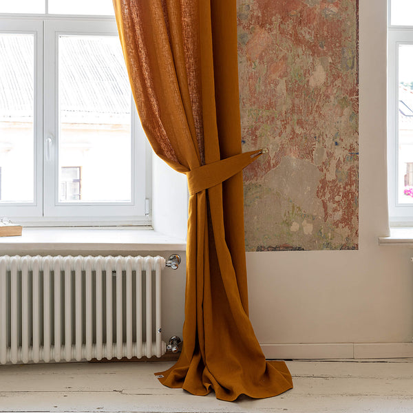 Our amber yellow linen curtain tie-back is the perfect solution for keeping your curtains looking neat and stylish. Made from the highest-quality European linen, they offer durability and a luxurious feel.