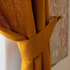 Our amber yellow linen curtain tie-back is the perfect solution for keeping your curtains looking neat and stylish. Made from the highest-quality European linen, they offer durability and a luxurious feel.