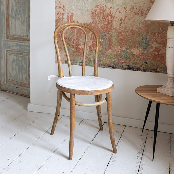 Say goodbye to worrying about stains or scratches, and hello to a beautifully refreshed chair that's both inviting and protected. Antique White Linen chair cover with soft padding inside.