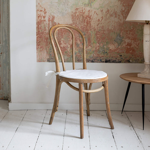 Say goodbye to worrying about stains or scratches, and hello to a beautifully refreshed chair that's both inviting and protected. Antique White Linen chair cover with soft padding inside.