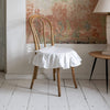 Our antique white linen ruffled chair slipcovers offer both practicality and aesthetic appeal. The covers will protect dining chairs from spills and stains, also enhance the visual appeal of your space with their timeless natural style. Slipcovers will simply change your chairs' appearance and provide an elegant solution.