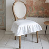 Our Antique white linen chair slipcovers offer both practicality and aesthetic appeal. The covers will protect dining chairs from spills and stains, also enhance the visual appeal of your space with their timeless natural style. Slipcovers will simply change your chairs appearance and provide an elegant solution.