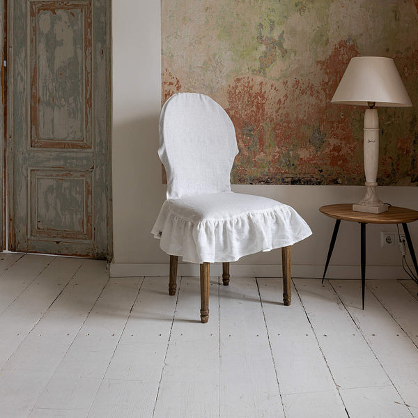 Our Antique white linen slipcovers offer both practicality and aesthetic appeal. The covers will protect dining chairs from spills and stains, also enhance the visual appeal of your space with their timeless natural style.