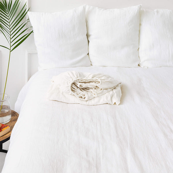 Our optical white linen fitted sheet, designed to elevate the comfort and style of your classical bedroom.Crafted from premium linen, these sheets offer a gentle touch and exceptional breathability, ensuring a luxurious sleeping experience every night.