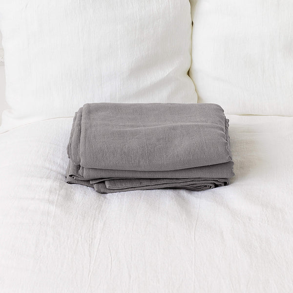 Introducing our luxurious linen flat sheet in a sophisticated charcoal grey colour. Whether you use it as a traditional top sheet for layering with blankets or as a standalone lightweight bedcover, it adds a touch of elegance to any decor scheme.
