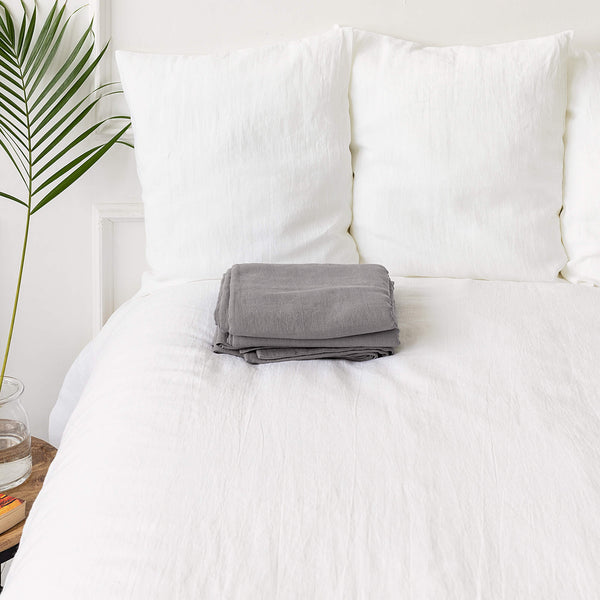 Introducing our luxurious linen flat sheet in a sophisticated charcoal grey colour. Whether you use it as a traditional top sheet for layering with blankets or as a standalone lightweight bedcover, it adds a touch of elegance to any decor scheme.