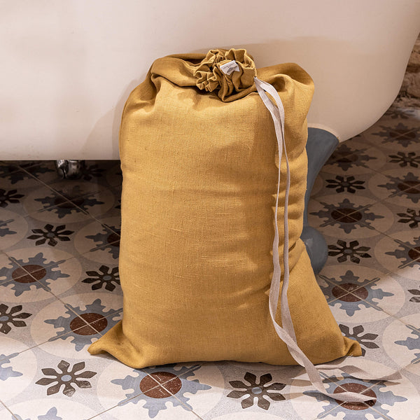 Introducing our dusty mustard linen laundry bag, the ultimate solution for keeping your laundry organised in style.