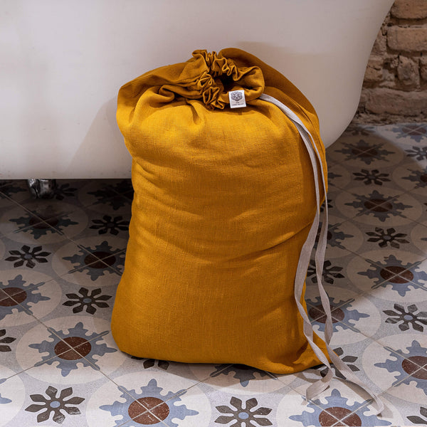 Introducing our amber yellow linen laundry bag, the ultimate solution for keeping your laundry organised in style.