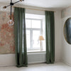 Lined moss green linen curtains with lining, designed and made to provide maximum protection from the sun and heat coming through the window. The natural thermoregulatory properties of linen will help you to create the most comfortable atmosphere.