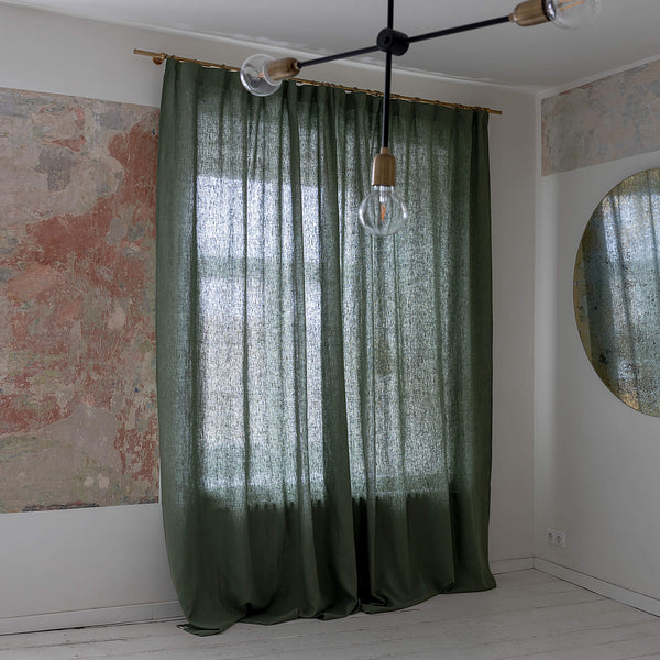 Lined moss green linen curtains with lining, designed and made to provide maximum protection from the sun and heat coming through the window. The natural thermoregulatory properties of linen will help you to create the most comfortable atmosphere.