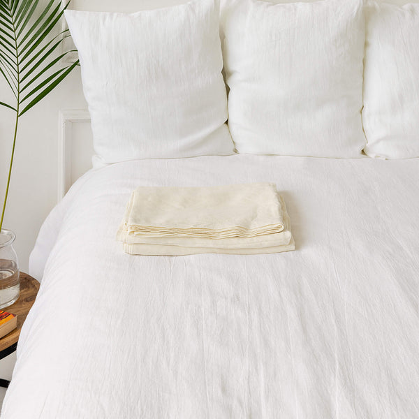 Linen flat sheet in off white colour. rafted with care, this flat sheet of your choice, providing you with everything you need for a blissful night's sleep.Versatile in function, our flat sheets can be used as top sheets for added warmth or as lightweight bedcovers during warmer nights.