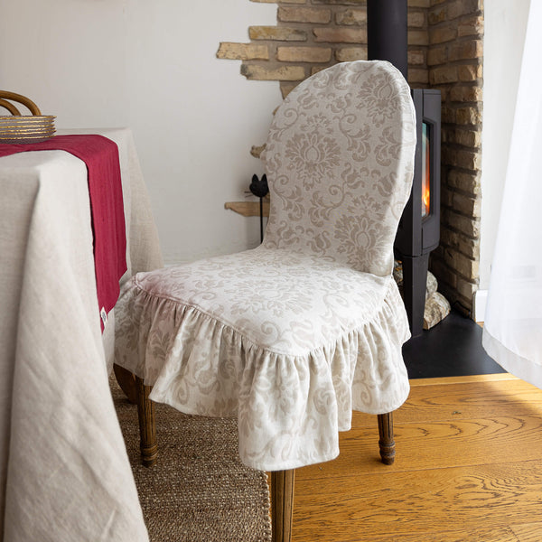 Our royal floral pattern linen chair slipcovers offer both practicality and aesthetic appeal.