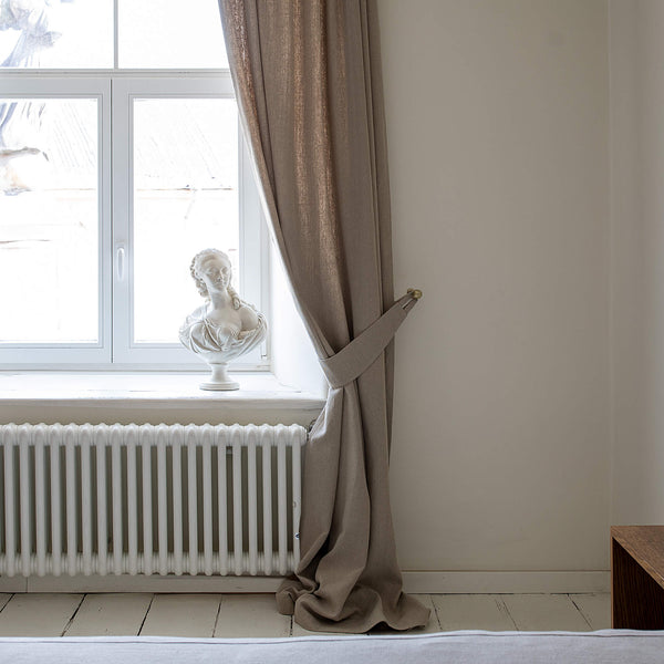 Our rustic heavy linen curtain tie-back is the perfect solution for keeping your curtains looking neat and stylish. Made from the highest-quality European linen, they offer durability and a luxurious feel.