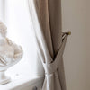 Our rustic heavy linen curtain tie-back is the perfect solution for keeping your curtains looking neat and stylish. Made from the highest-quality European linen, they offer durability and a luxurious feel.