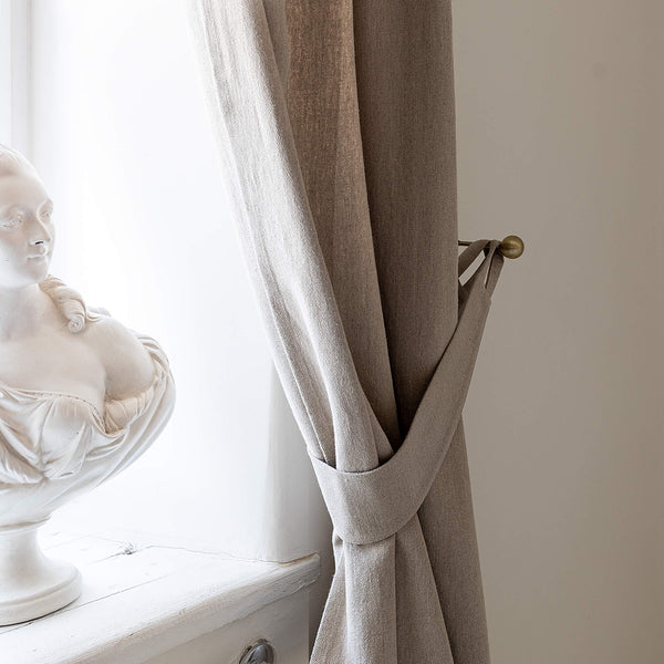 Our rustic heavy linen curtain tie-back is the perfect solution for keeping your curtains looking neat and stylish. Made from the highest-quality European linen, they offer durability and a luxurious feel.