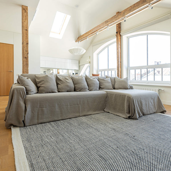 Our rustic unbleached linen sectional couch cover a stylish way to change up the look of the room. Plus, linen has natural properties that make it resistant to stains and easy to clean, which adds to its appeal for everyday use.