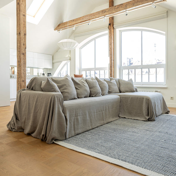 Our rustic unbleached linen sectional couch cover a stylish way to change up the look of the room. Plus, linen has natural properties that make it resistant to stains and easy to clean, which adds to its appeal for everyday use.