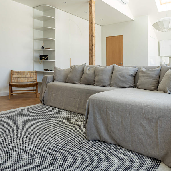 Our rustic unbleached linen sectional couch cover a stylish way to change up the look of the room. Plus, linen has natural properties that make it resistant to stains and easy to clean, which adds to its appeal for everyday use.
