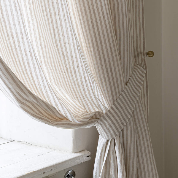 Our striped linen curtain tie-back is the perfect solution for keeping your curtains looking neat and stylish. Made from the highest-quality European linen, they offer durability and a luxurious feel.